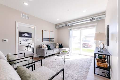 a living room with a couch and a table at Converge NW, Waukee Iowa  