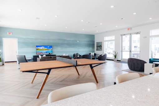 a large living room with a table and chairs at Converge NW, Iowa  