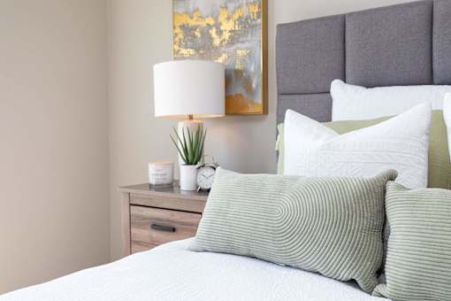 Bedroom With Pillows at Lake Shore Apartments, Ankeny, Iowa