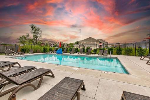 the pool at our apartments with tables and chairs around it at Lake Shore Apartments, Ankeny, 50021