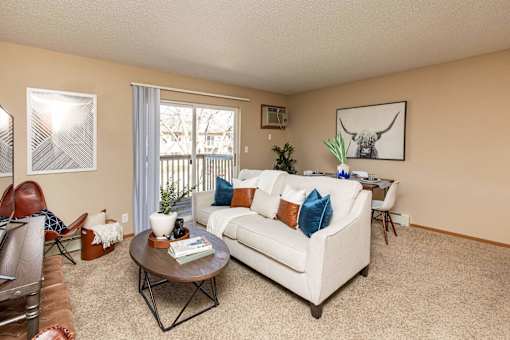 a living room with a couch and a table at Lake Shore Park, Ankeny, Iowa