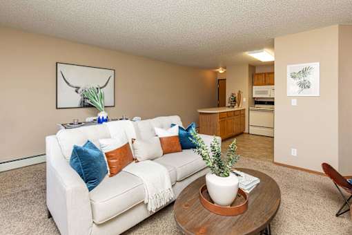 a living room with a couch and a table at Lake Shore Park, Ankeny, Iowa
