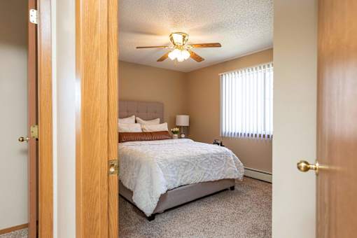 a bedroom with a bed and a closet at Lake Shore Park, Ankeny, Iowa