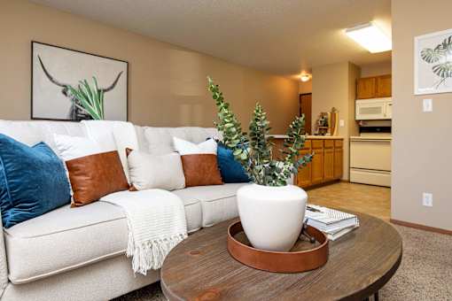 a living room with a white couch and a coffee table at Lake Shore Park, Iowa 50021