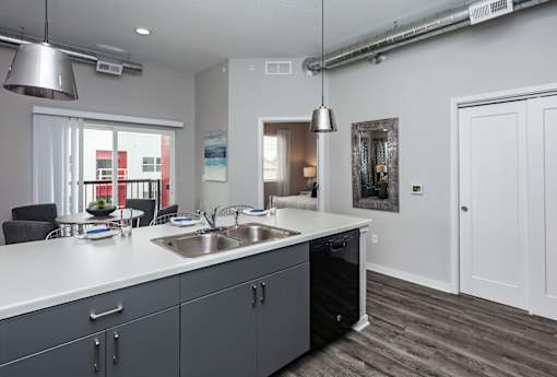 a kitchen with a large counter top and a sink at Vue Apartments, Des Moines, IA