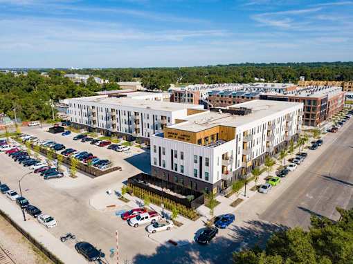 an aerial view of an apartment complex and parking lot at Rowat Lofts, Des Moines  