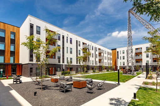 a courtyard in front of a row of apartment buildings at Rowat Lofts, Des Moines, IA 50309  