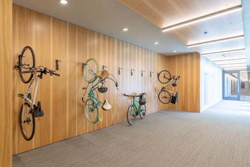 three bikes hanging on a wall in a room at Rowat Lofts, Des Moines, IA 50309  