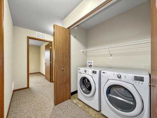 A laundry room with a washer and dryer.at Cornerstone Commons, Johnston Iowa  