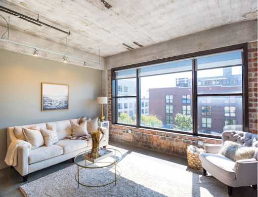 Living Room With Expansive Window at Clemens Building, Des Moines, Iowa
