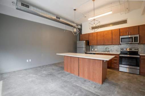 Modern Kitchen With Stainless Steel Appliances And Double Door Refrigerators at Clemens Building, Des Moines, IA, Iowa , 50309
