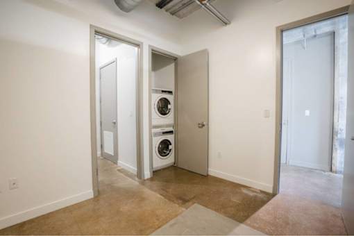 Laundry room with a washer and dryer in it at Clemens Building, Des Moines, IA