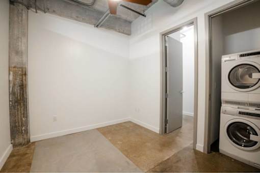 A laundry room with a washer and dryer at Clemens Building, Des Moines