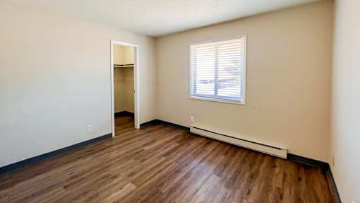 A room with large window at The Hampton Meadows Apartments,Iowa
