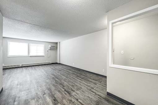 A room with a window and a door at The Ridges Apartments, IA, 50315