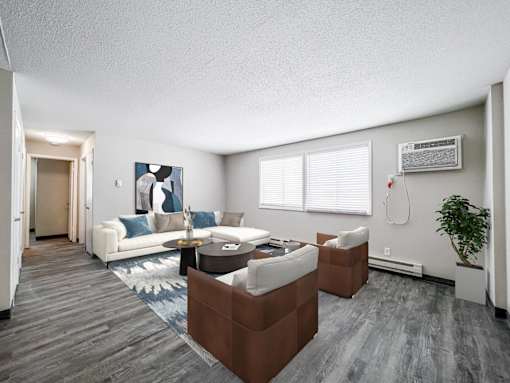A living room with a white couch and a brown coffee table at The Ridges Apartments, Des Moines, Iowa