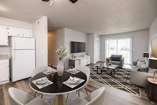 A modern dining room with a black table and chairs.at Fish Creek, Norwalk, IA 50211  