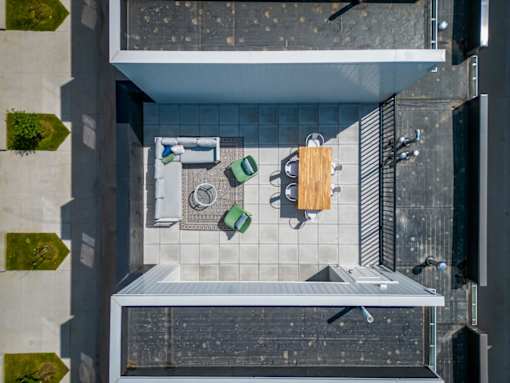 an overhead view of a bathroom with a sink and a shower at Matilda 235 Townhomes, Des Moines
