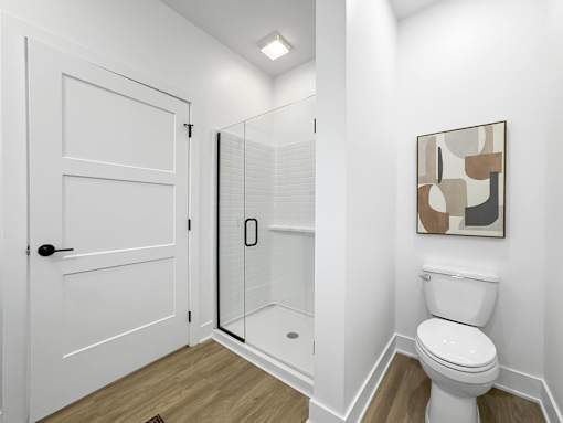 a bathroom with a toilet and a shower at Matilda 235 Townhomes, Des Moines