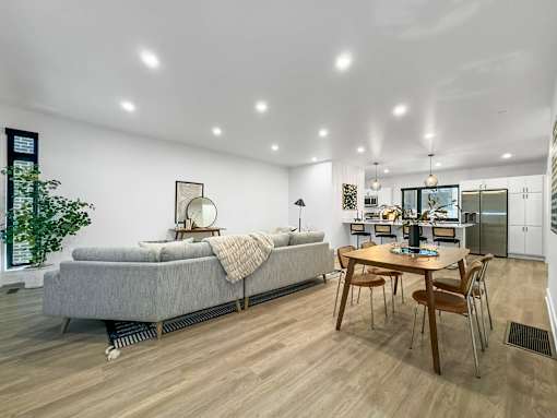 a living room with a couch and a table at Matilda 235 Townhomes, Des Moines, 50309