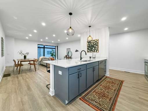 a kitchen with a blue island in the middle of it at Matilda 235 Townhomes, Iowa