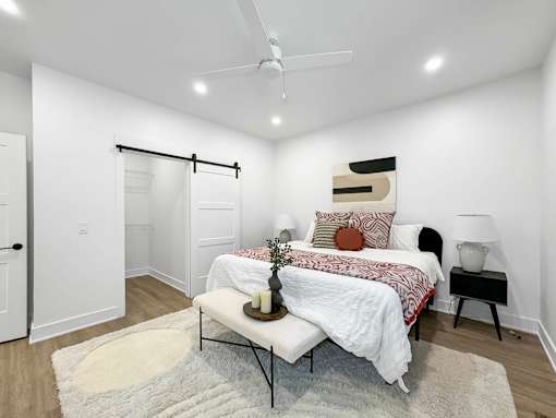 a bedroom with a bed and a closet at Matilda 235 Townhomes, Iowa