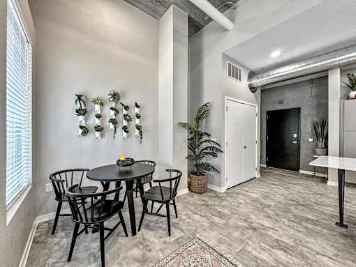 A dining room with a round table and chairs.at Level, Iowa   