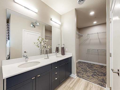 a bathroom with a sink and a shower at Linc, Des Moines, 50309  