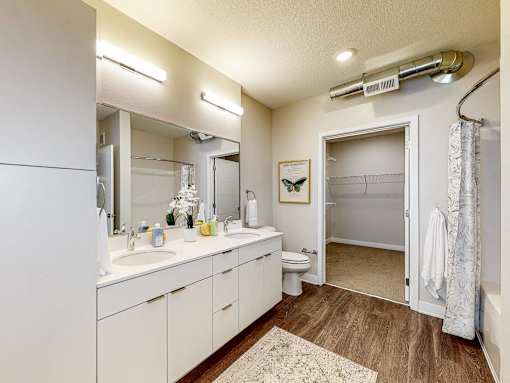 a bathroom with a sink and a toilet and a shower at Linc, Des Moines, 50309  