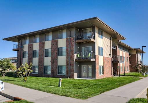Building with balconies and a sidewalk at Cedarbrooke Place , Norwalk, IA, Iowa , 50211