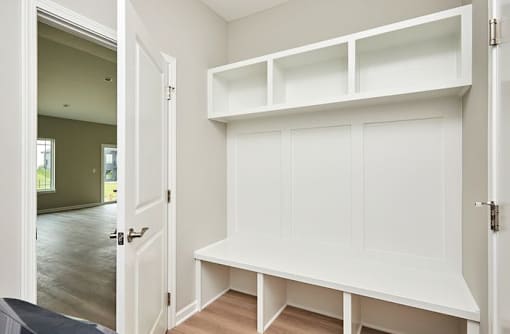 an empty room with a white closet and a door at Two Rivers Home Rentals, West Des Moines, IA