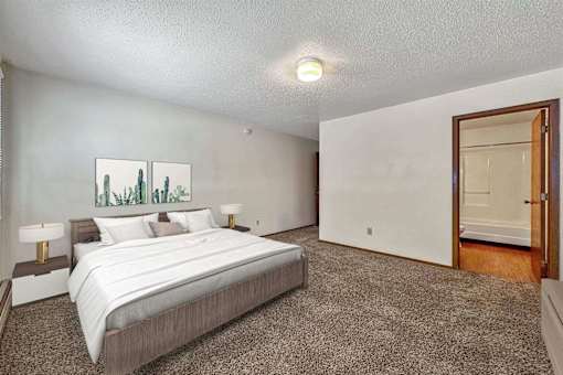 a bedroom with a bed and a door to a closet at Autumn Park, South Dakota  