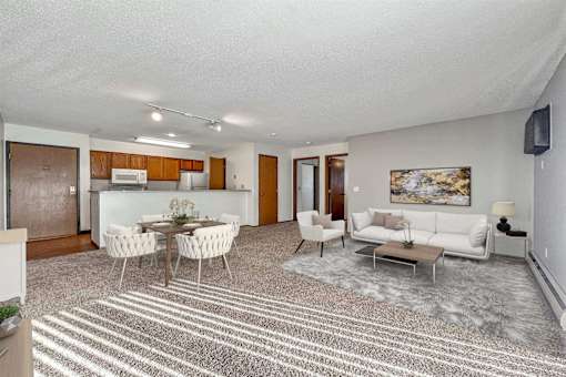 a living room with a couch and a table at Autumn Park, Sioux Falls, SD  
