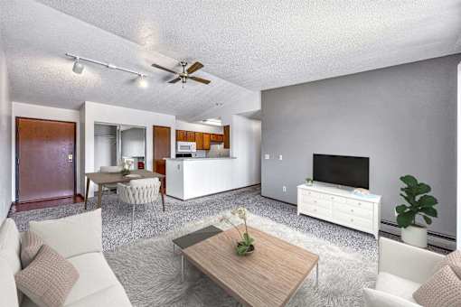 a living room with a couch and a table at Autumn Park, South Dakota, 57106