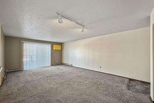 an empty living room with blinds on the window at Autumn Park, Sioux Falls, SD 57106  