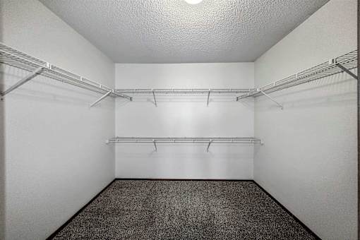 the walk in closet of an empty room with shelves at Autumn Park, South Dakota, 57106