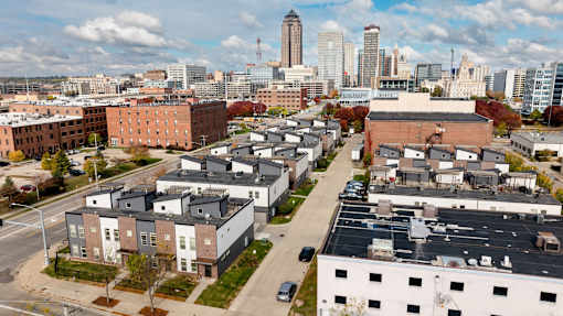 A cityscape with buildings and a clear sky.