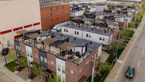 A view of a residential area with houses and cars.