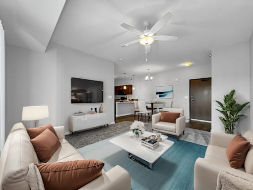 a living room with couches and a coffee table at Stonegate Crossing Apartments, Clive, IA, 50325