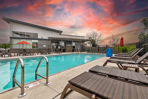 our apartments have a large swimming pool and lounge chairs at Lake Shore Park, Ankeny, IA 50021