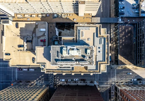 A top-down view of a cityscape with buildings and vehicles.