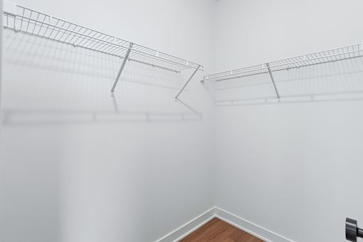 Walk-in closet with wire shelving at The Flats at West Glen Apartments, Iowa, 50266