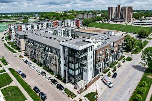 an aerial view of an apartment building in a city at Velocity Apartments, IA, 50309