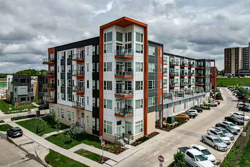 an aerial view of an apartment building on a city street at Velocity Apartments, Iowa, 50309