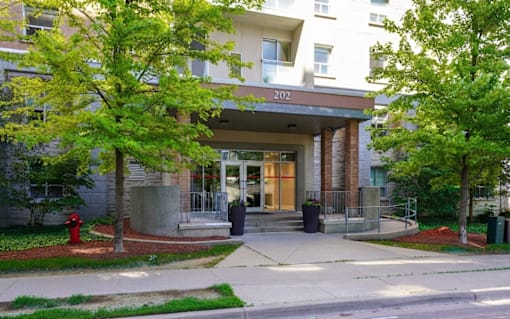 The entrance to apartment building number 202 is visible.