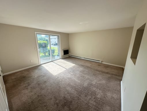a living room with a door to a patio