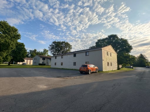 a car parked in front of a house on a street