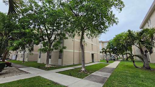 A building with a tree in front of it.