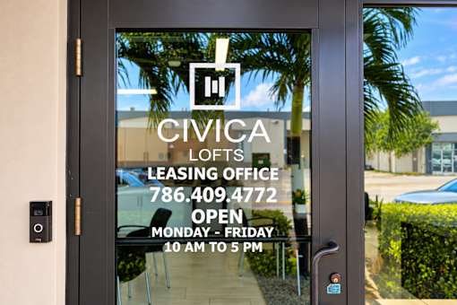 A glass door with Civica Lofts Leasing Office written on it.