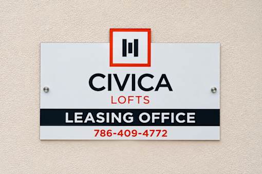 A sign for Civica Lofts Leasing Office with a phone number.